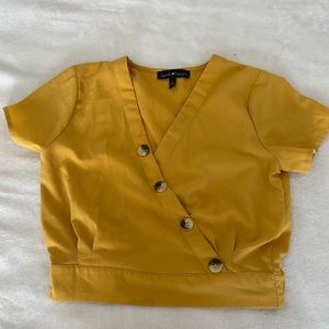 Yellow wrap top with faux brown buttons